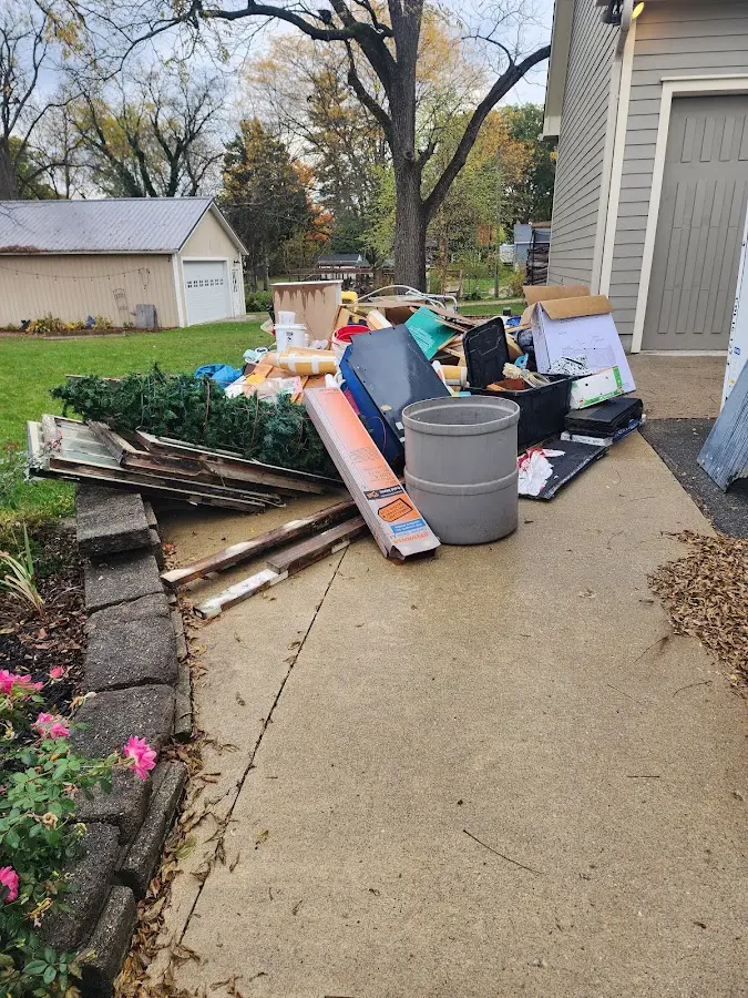 Dumpster being loaded with debris for 3 Yard Dumpster Rental in Alturas